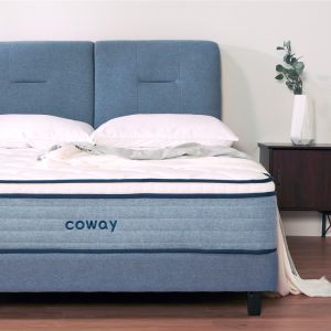 front-view-of-coway-prime-lite-series-mattress-with-complete-bedsheets-and-a-blue-bedframe-along-a-side-table-with-a-plant.jpg
